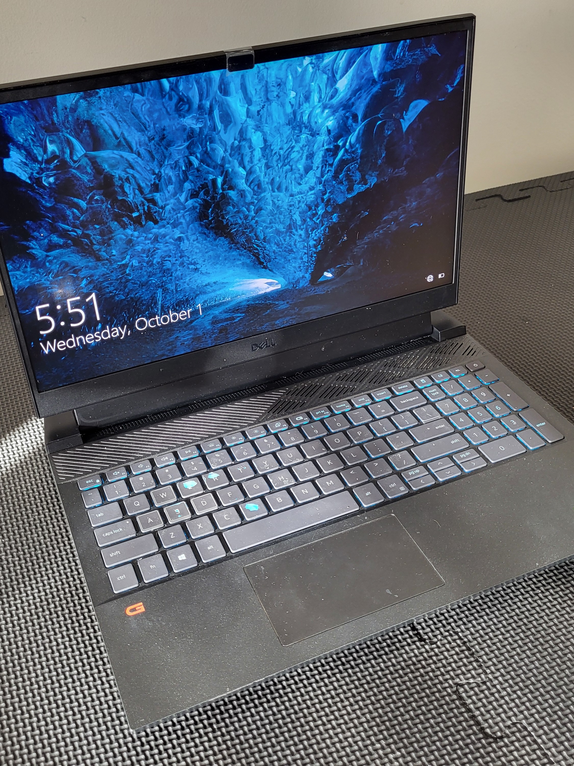 A dirty laptop with keyboard issues.
